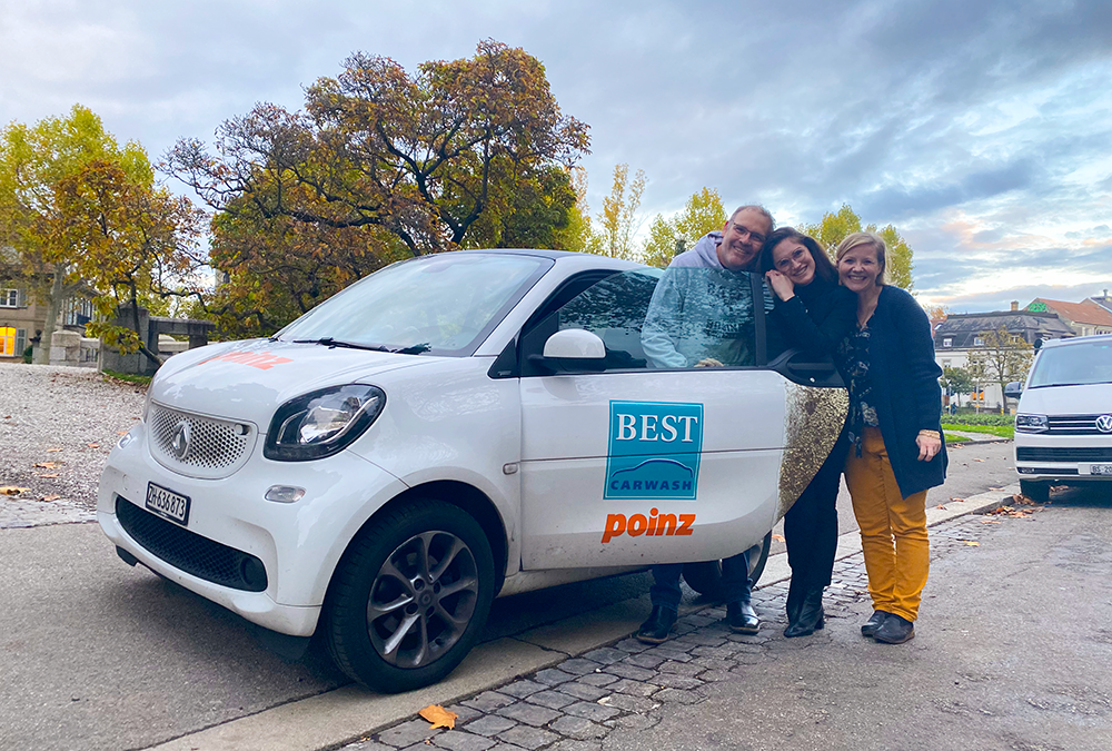 Besmira, a student from Weinberg United Business Schools, celebrating her company car during her internship at Poinz